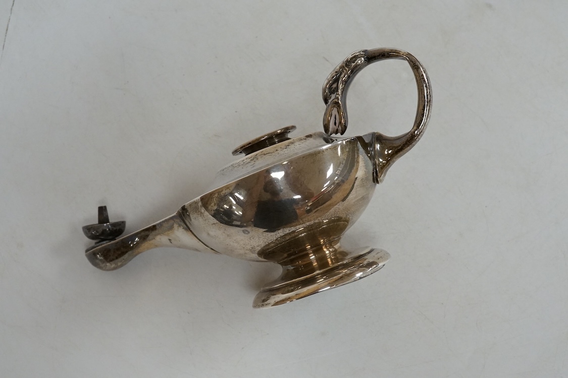 A George V Asprey & Co silver table lighter, modelled as an 'Aladdin' oil lamp, Birmingham, 1911, length 16cm, weighted.